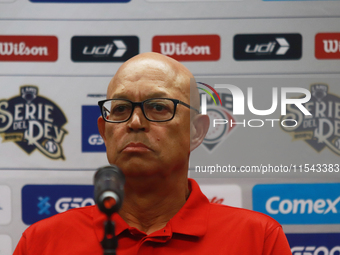 Lorenzo Bundy, manager of the Diablos Rojos of Mexico, speaks during a press conference to announce his pitching rotation to face Sultanes d...