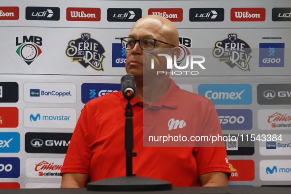 Lorenzo Bundy, manager of the Diablos Rojos of Mexico, speaks during a press conference to announce his pitching rotation to face Sultanes d...