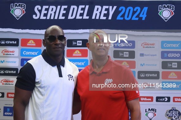 Roberto Kelly, manager of Sultanes de Monterrey, and Lorenzo Bundy, manager of Diablos Rojos, pose for photos after the press conference for...