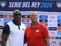 Roberto Kelly, manager of Sultanes de Monterrey, and Lorenzo Bundy, manager of Diablos Rojos, pose for photos after the press conference for...