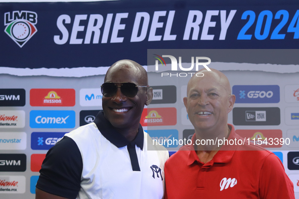 Roberto Kelly, manager of Sultanes de Monterrey, and Lorenzo Bundy, manager of Diablos Rojos, pose for photos after the press conference for...