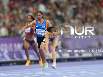 Yuliia Shuliar of Ukraine celebrates winning gold in Women's 400m - T20 Final during the Paris 2024 Paralympic Games at Stade de France on S...