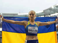 Yuliia Shuliar of Ukraine celebrates winning gold in Women's 400m - T20 Final during the Paris 2024 Paralympic Games at Stade de France on S...