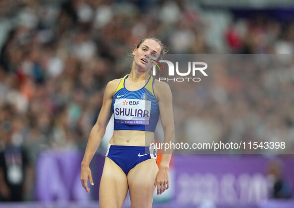 Yuliia Shuliar of Ukraine celebrates winning gold in Women's 400m - T20 Final during the Paris 2024 Paralympic Games at Stade de France on S...