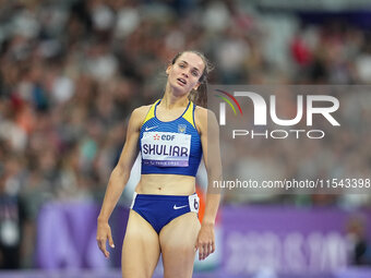 Yuliia Shuliar of Ukraine celebrates winning gold in Women's 400m - T20 Final during the Paris 2024 Paralympic Games at Stade de France on S...