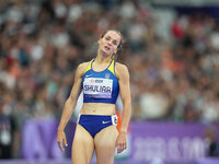 Yuliia Shuliar of Ukraine celebrates winning gold in Women's 400m - T20 Final during the Paris 2024 Paralympic Games at Stade de France on S...