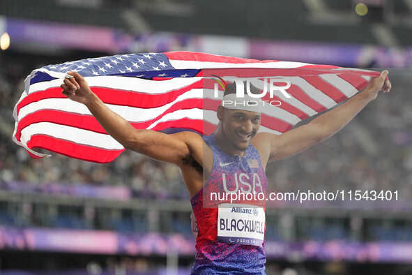 Jaydin Blackwell of United States of America celebrates winning gold in Men's 400m - T38 Final during the Paris 2024 Paralympic Games at Sta...