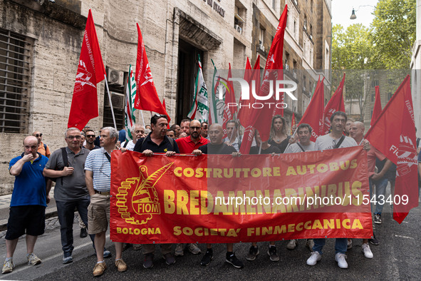 Italian bus industry workers rally in front of the Enterprises & Made in Italy Ministry to protest against the factory relocation from Bolog...