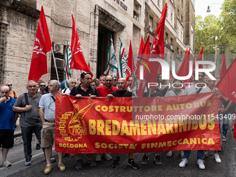 Italian bus industry workers rally in front of the Enterprises & Made in Italy Ministry to protest against the factory relocation from Bolog...