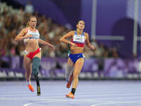 B Hatz of United States of America celebrates winning silver in Women's 200m - T64 Final during the Paris 2024 Paralympic Games at Stade de...