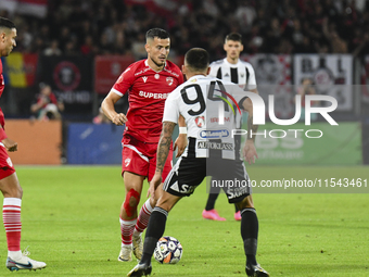 Astrit Selmani is in action during Universitatea Cluj vs. Dinamo Bucuresti at Cluj Arena in Cluj-Napoca, Romania, on September 2, 2024 (