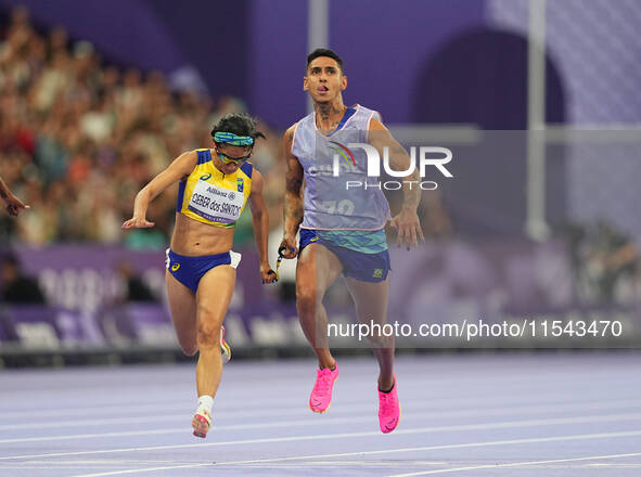 Jerusa Geber Dos Santos of Brazil celebrates winning gold in Women's 100m - T11 Final during the Paris 2024 Paralympic Games at Stade de Fra...