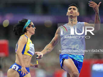 Jerusa Geber Dos Santos of Brazil celebrates winning gold in Women's 100m - T11 Final during the Paris 2024 Paralympic Games at Stade de Fra...