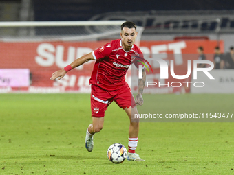 Raul Oprut is in action during Universitatea Cluj vs. Dinamo Bucuresti at Cluj Arena in Cluj-Napoca, Romania, on September 2, 2024 (