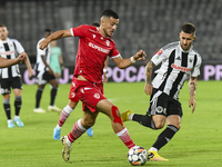 Astrit Selmani and Ovidiu Popescu are in action during Universitatea Cluj vs. Dinamo Bucuresti at Cluj Arena in Cluj-Napoca, Romania, on Sep...