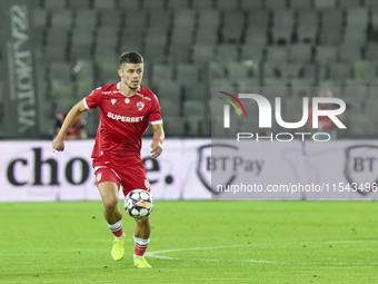 Cristian Costin is in action during Universitatea Cluj vs. Dinamo Bucuresti at Cluj Arena in Cluj-Napoca, Romania, on September 2, 2024 (