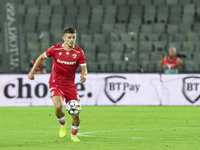 Cristian Costin is in action during Universitatea Cluj vs. Dinamo Bucuresti at Cluj Arena in Cluj-Napoca, Romania, on September 2, 2024 (