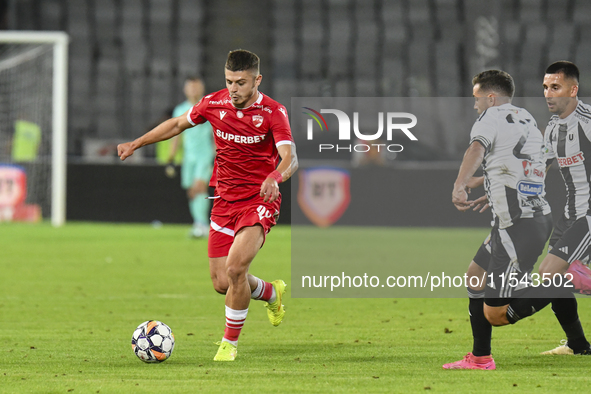 Cristian Costin is in action during Universitatea Cluj vs. Dinamo Bucuresti at Cluj Arena in Cluj-Napoca, Romania, on September 2, 2024 