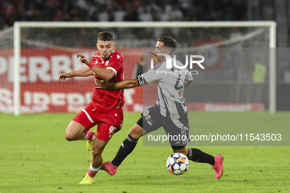 Cristian Costin and Alexandru Chipciu are in action during Universitatea Cluj vs. Dinamo Bucuresti at Cluj Arena in Cluj-Napoca, Romania, on...