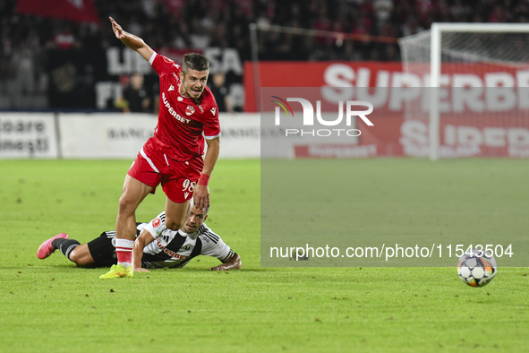 Cristian Costin and Alexandru Chipciu are in action during Universitatea Cluj vs. Dinamo Bucuresti at Cluj Arena in Cluj-Napoca, Romania, on...