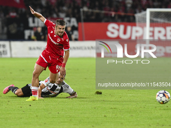 Cristian Costin and Alexandru Chipciu are in action during Universitatea Cluj vs. Dinamo Bucuresti at Cluj Arena in Cluj-Napoca, Romania, on...