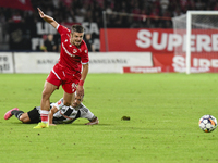 Cristian Costin and Alexandru Chipciu are in action during Universitatea Cluj vs. Dinamo Bucuresti at Cluj Arena in Cluj-Napoca, Romania, on...