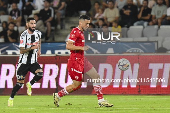 Astrit Selmani is in action during Universitatea Cluj vs. Dinamo Bucuresti at Cluj Arena in Cluj-Napoca, Romania, on September 2, 2024 