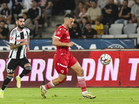 Astrit Selmani is in action during Universitatea Cluj vs. Dinamo Bucuresti at Cluj Arena in Cluj-Napoca, Romania, on September 2, 2024 (