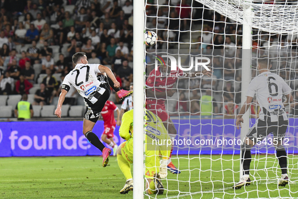 Josue Homawoo is in action during Universitatea Cluj vs. Dinamo Bucuresti at Cluj Arena in Cluj-Napoca, Romania, on September 2, 2024. 