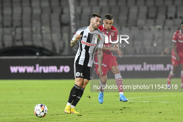 Catalin Cirjan and Ovidiu Popescu are in action during the Universitatea Cluj vs. Dinamo Bucuresti match at Cluj Arena in Cluj-Napoca, Roman...