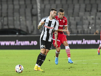 Catalin Cirjan and Ovidiu Popescu are in action during the Universitatea Cluj vs. Dinamo Bucuresti match at Cluj Arena in Cluj-Napoca, Roman...