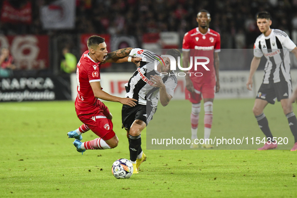 Catalin Cirjan and Ovidiu Popescu are in action during the Universitatea Cluj vs. Dinamo Bucuresti match at Cluj Arena in Cluj-Napoca, Roman...