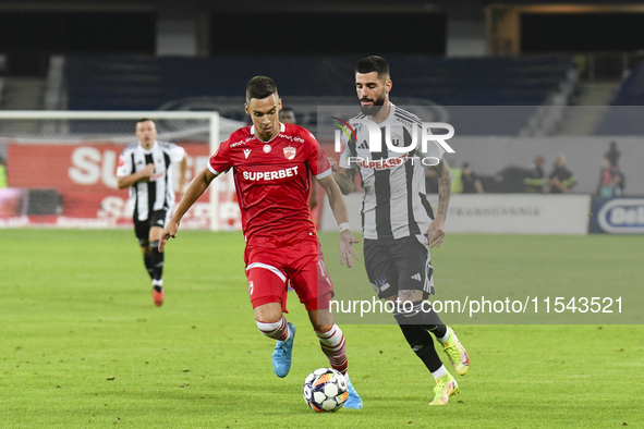 Catalin Cirjan and Radu Boboc are in action during Universitatea Cluj vs. Dinamo Bucuresti at Cluj Arena in Cluj-Napoca, Romania, on Septemb...