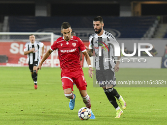 Catalin Cirjan and Radu Boboc are in action during Universitatea Cluj vs. Dinamo Bucuresti at Cluj Arena in Cluj-Napoca, Romania, on Septemb...