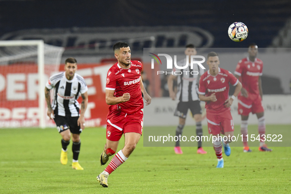 Astrit Selmani is in action during Universitatea Cluj vs. Dinamo Bucuresti at Cluj Arena in Cluj-Napoca, Romania, on September 2, 2024 