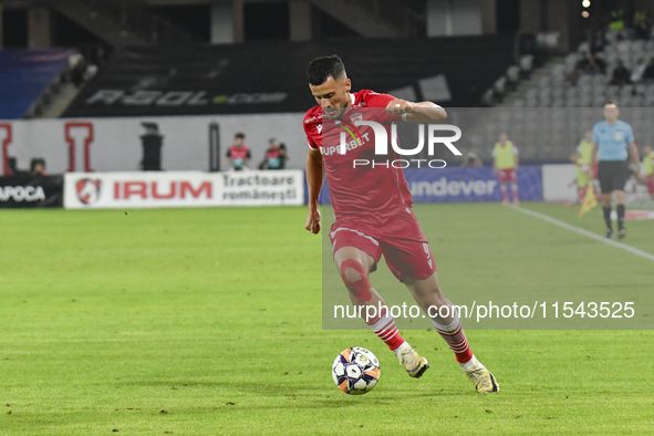 Astrit Selmani is in action during Universitatea Cluj vs. Dinamo Bucuresti at Cluj Arena in Cluj-Napoca, Romania, on September 2, 2024 