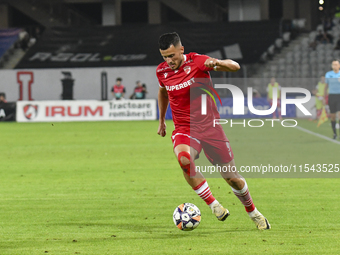 Astrit Selmani is in action during Universitatea Cluj vs. Dinamo Bucuresti at Cluj Arena in Cluj-Napoca, Romania, on September 2, 2024 (