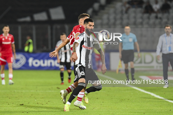 Radu Boboc is in action during Universitatea Cluj vs. Dinamo Bucuresti at Cluj Arena in Cluj-Napoca, Romania, on September 2, 2024 