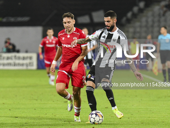 Radu Boboc and Ahmed Bani are in action during Universitatea Cluj vs. Dinamo Bucuresti at Cluj Arena in Cluj-Napoca, Romania, on September 2...