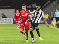 Radu Boboc and Ahmed Bani are in action during Universitatea Cluj vs. Dinamo Bucuresti at Cluj Arena in Cluj-Napoca, Romania, on September 2...