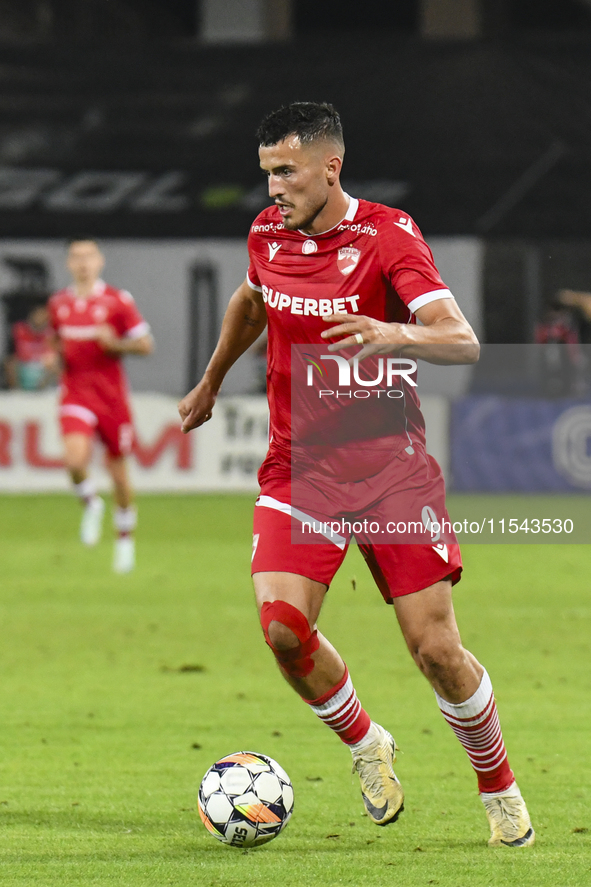 Astrit Selmani is in action during Universitatea Cluj vs. Dinamo Bucuresti at Cluj Arena in Cluj-Napoca, Romania, on September 2, 2024 