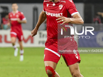 Astrit Selmani is in action during Universitatea Cluj vs. Dinamo Bucuresti at Cluj Arena in Cluj-Napoca, Romania, on September 2, 2024 (