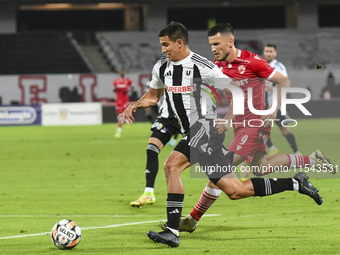 Astrit Selmani and Lucas Masoero are in action during Universitatea Cluj vs. Dinamo Bucuresti at Cluj Arena in Cluj-Napoca, Romania, on Sept...