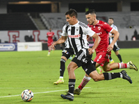 Astrit Selmani and Lucas Masoero are in action during Universitatea Cluj vs. Dinamo Bucuresti at Cluj Arena in Cluj-Napoca, Romania, on Sept...