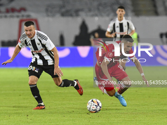 Catalin Cirjan and Vadim Rata are in action during Universitatea Cluj vs. Dinamo Bucuresti at Cluj Arena in Cluj-Napoca, Romania, on Septemb...