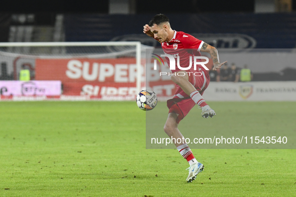 Raul Oprut is in action during Universitatea Cluj vs. Dinamo Bucuresti at Cluj Arena in Cluj-Napoca, Romania, on September 2, 2024 