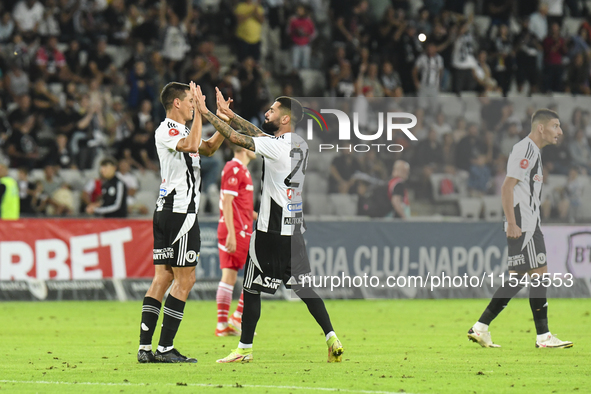 Lucas Masoero and Radu Boboc are in action during Universitatea Cluj vs. Dinamo Bucuresti at Cluj Arena in Cluj-Napoca, Romania, on Septembe...