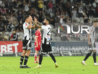 Lucas Masoero and Radu Boboc are in action during Universitatea Cluj vs. Dinamo Bucuresti at Cluj Arena in Cluj-Napoca, Romania, on Septembe...