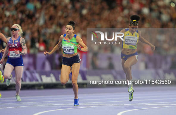 Lamiya Valiyeva of Azerbaijan celebrates winning gold in Women's 100m - T13 Final during the Paris 2024 Paralympic Games at Stade de France...