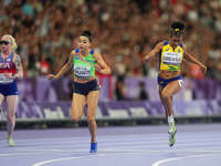 Lamiya Valiyeva of Azerbaijan celebrates winning gold in Women's 100m - T13 Final during the Paris 2024 Paralympic Games at Stade de France...